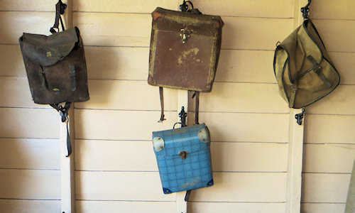 Bags hanging on the schoolroom wall. I had a well-used version of the blue one. but I think it was a different colour.
